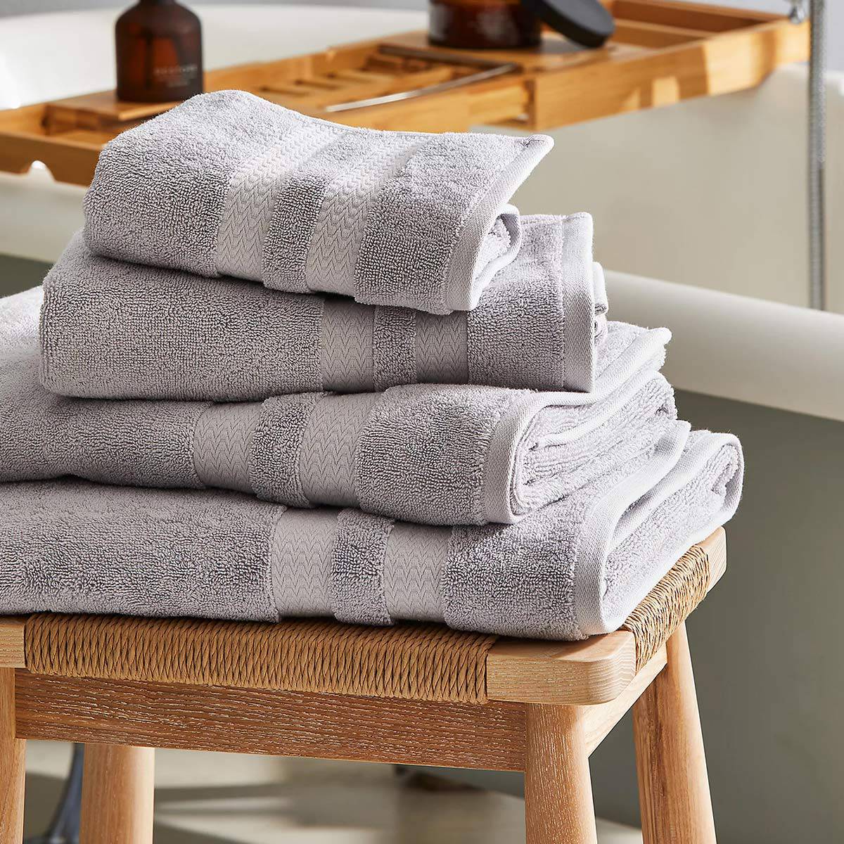 Light-grey towels on stool